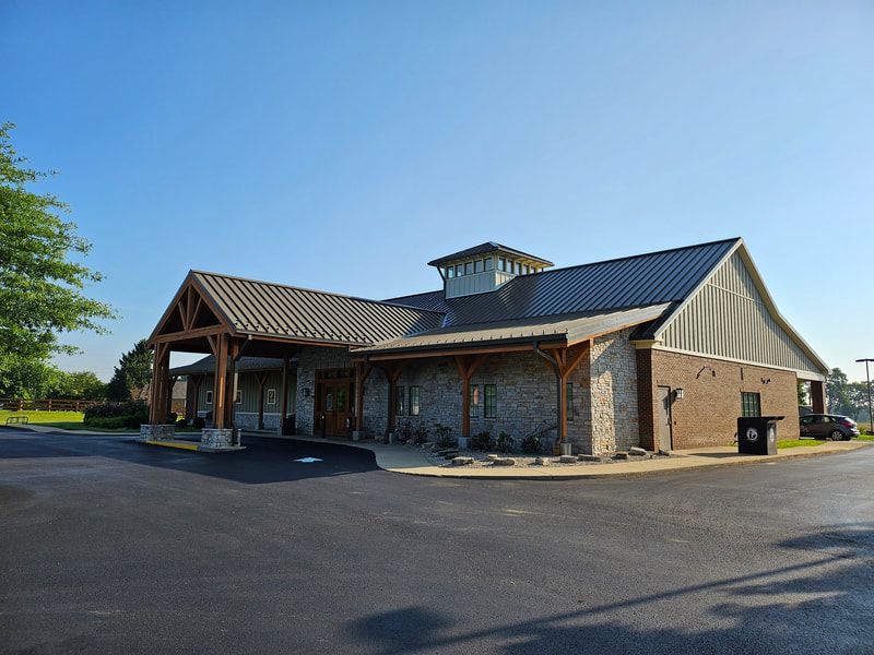 A large brick building with a metal roof