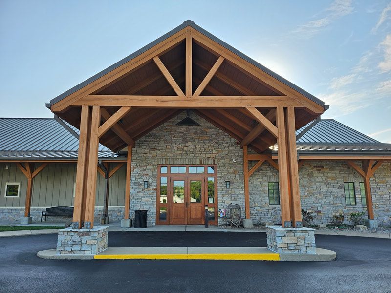 A large stone building with a metal roof