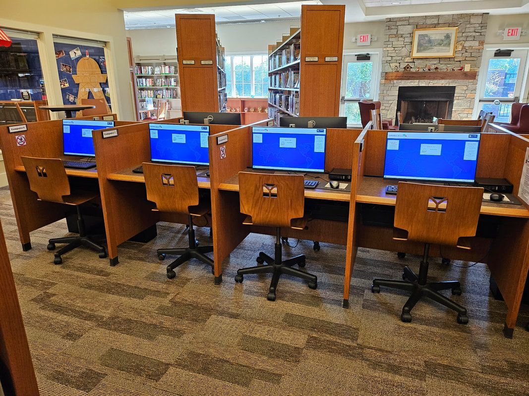 A row of computer cubicles in a library