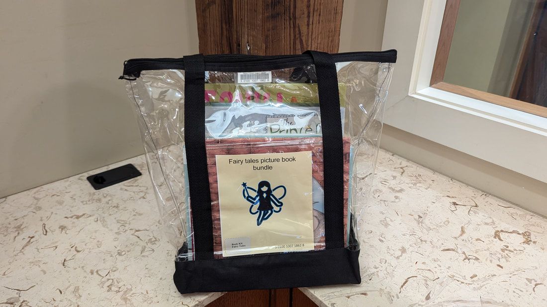 A clear bag with a picture of a fairy on it
