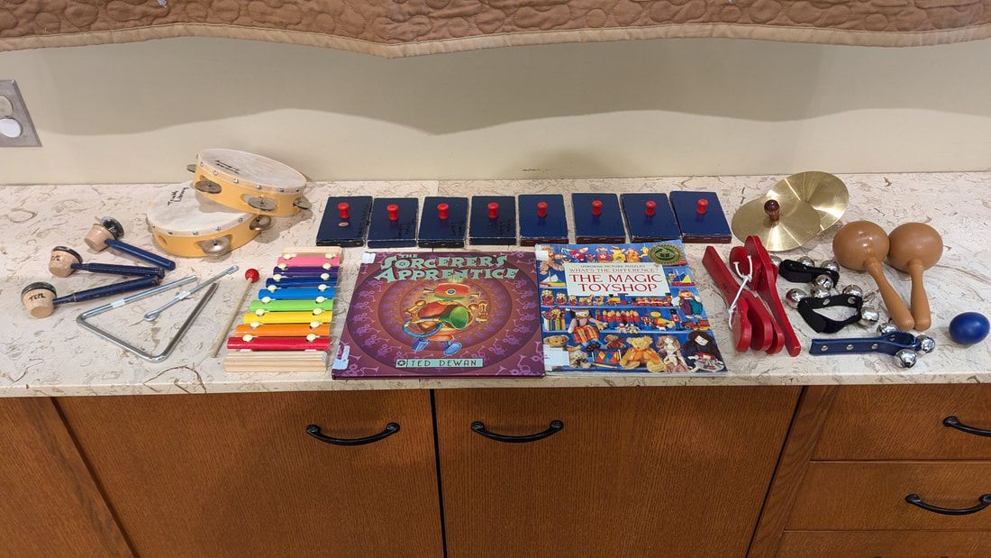 A table full of percussion instruments including a xylophone