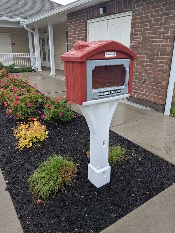 A small red box on a white post
