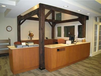 A cicrulation desk with wooden beams.