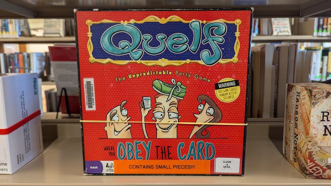 The board game Quelf sits on a shelf