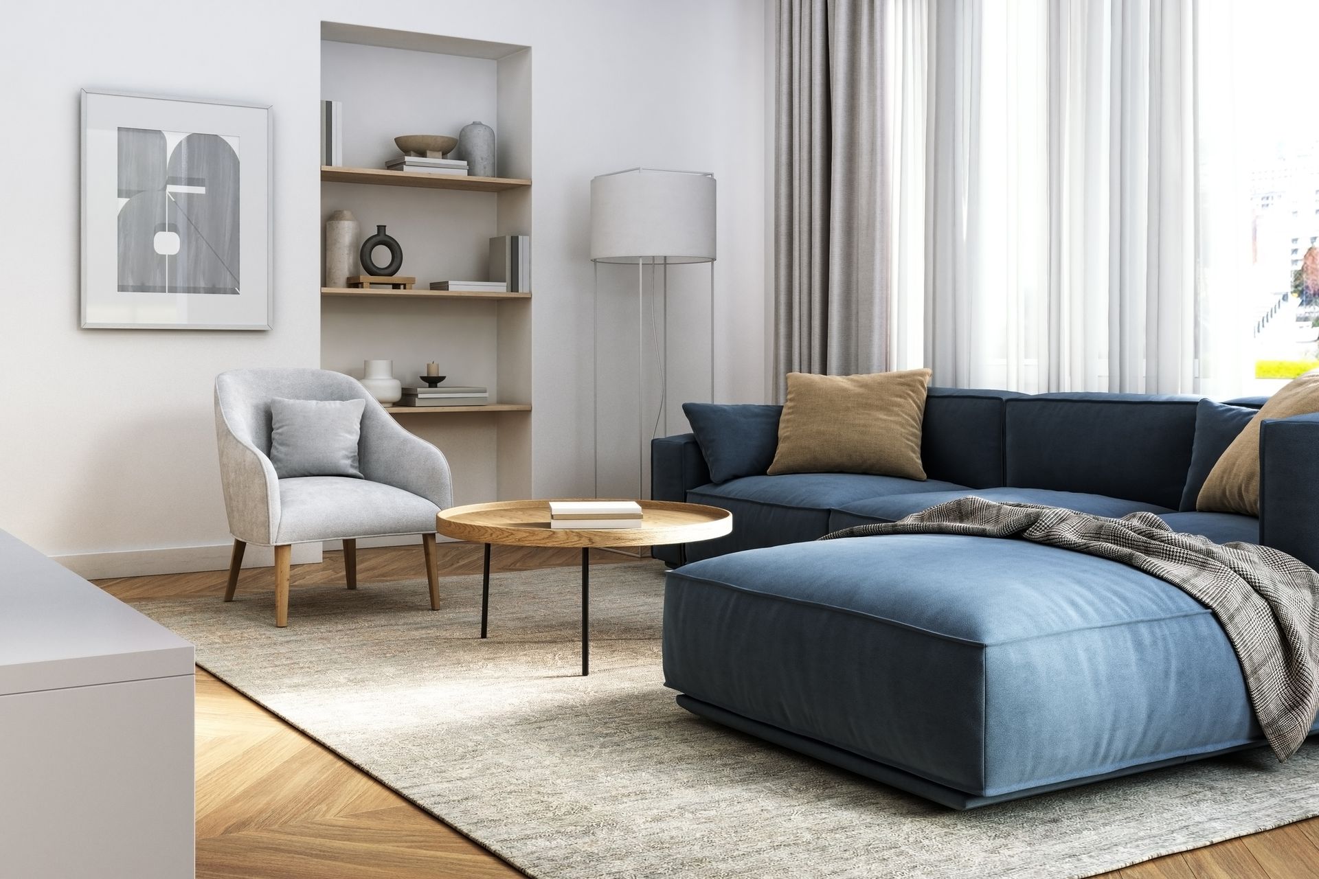 a living room with a blue sectional couch , chair , coffee table and rug .