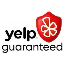 A yelp guaranteed logo with a red shield and a white flower.