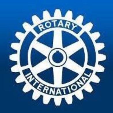 Rotary International logo: white gear with 