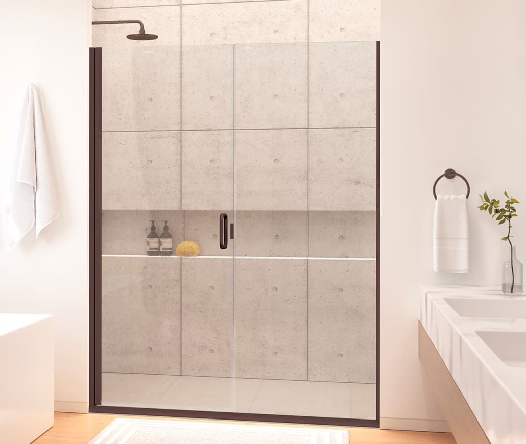 A bathroom with a sliding glass shower door