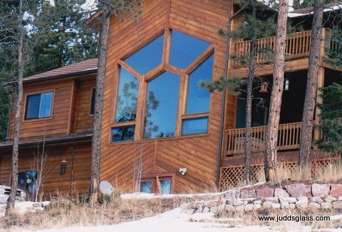 A large wooden house with a lot of windows