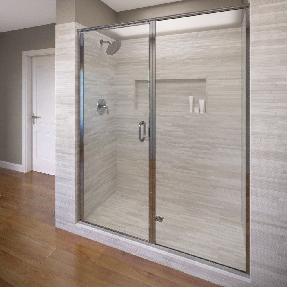 A bathroom with a walk in shower with a glass door.