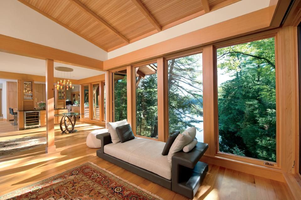 A living room with a couch and lots of windows