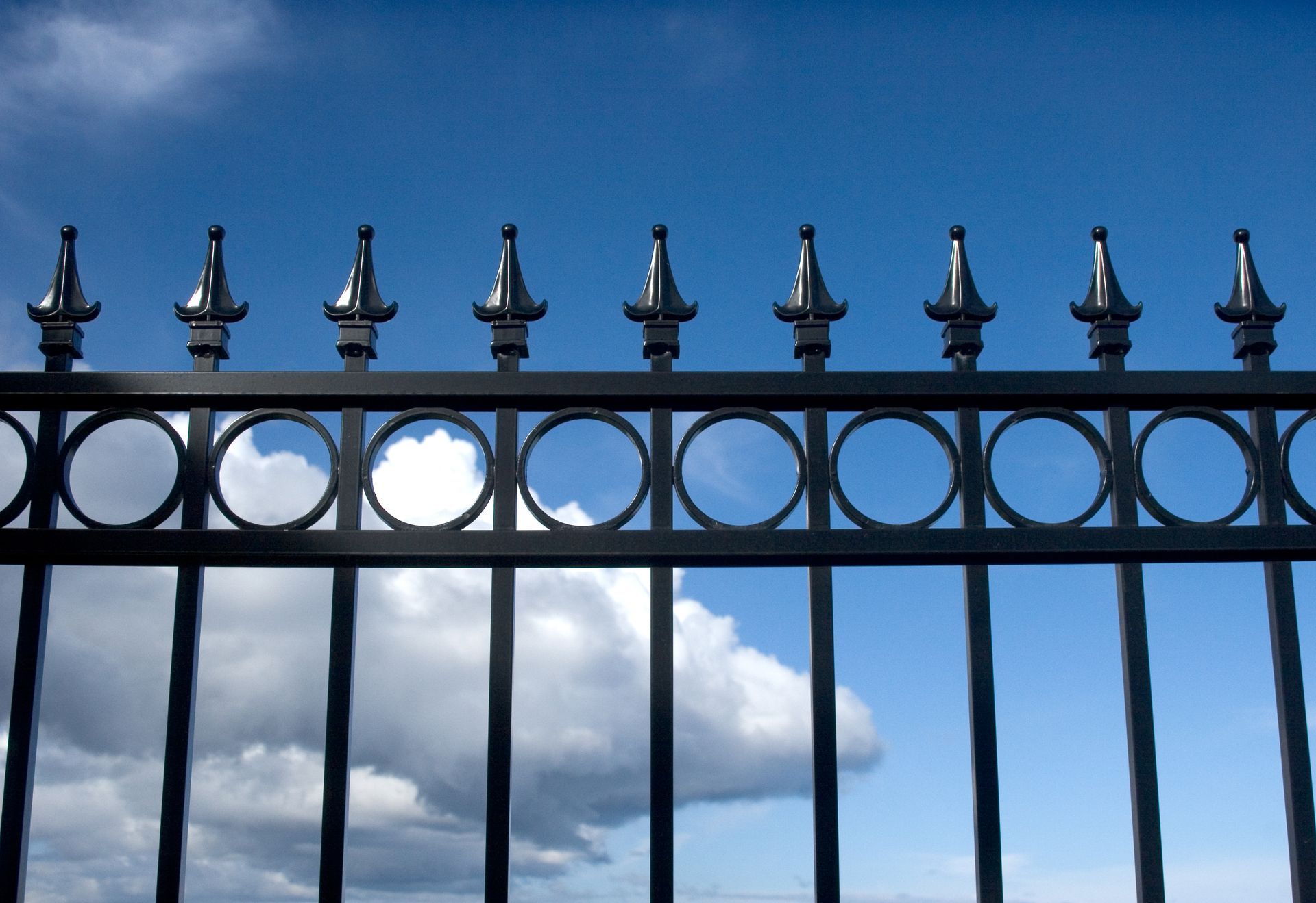 Close-Up of A Metal Iron Fence with Intricate Design, Outdoor Architectural Detail