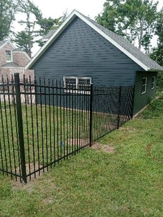 Black Metal Iron Fence surrounding house