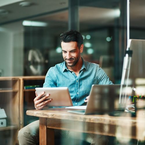 royal realty Lawrenceville Georgia - services image man looking at a property listing