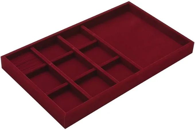 Red jewelry tray with divided compartments.