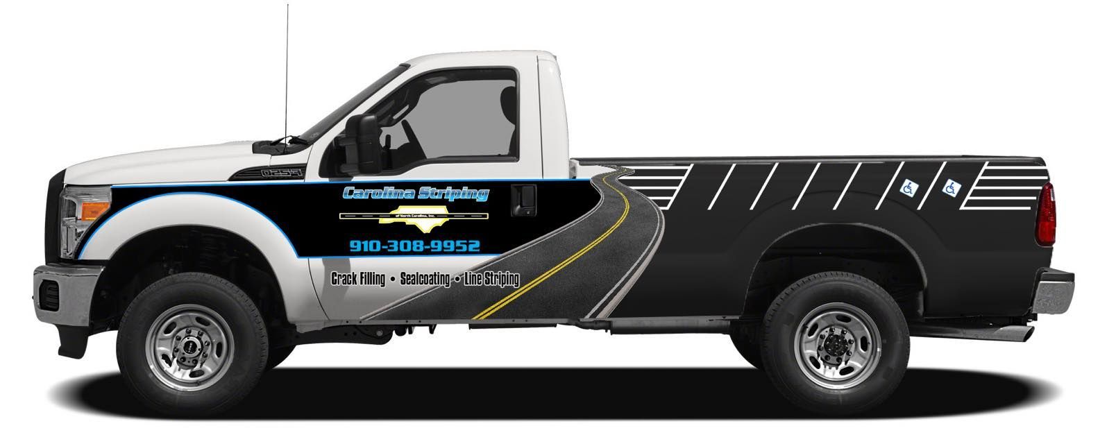A white pickup truck with a black wrap featuring road graphics and the Carolina Striping logo.