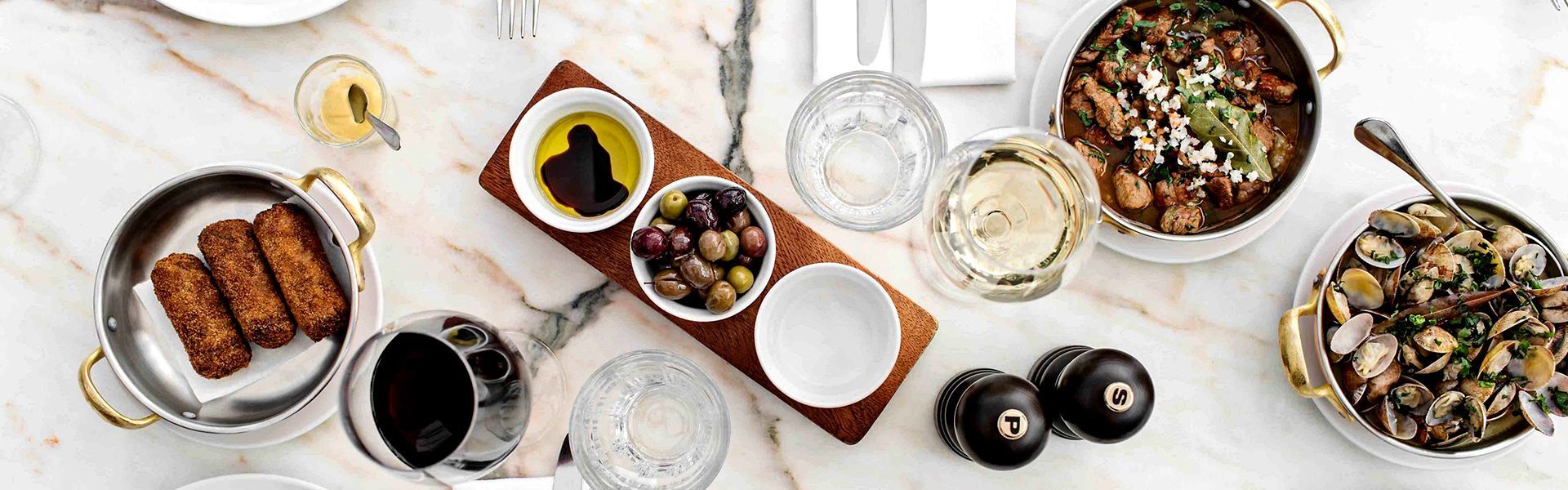 There are many different types of food on the table. Aprazível Restaurant, fanstastic food any time.
