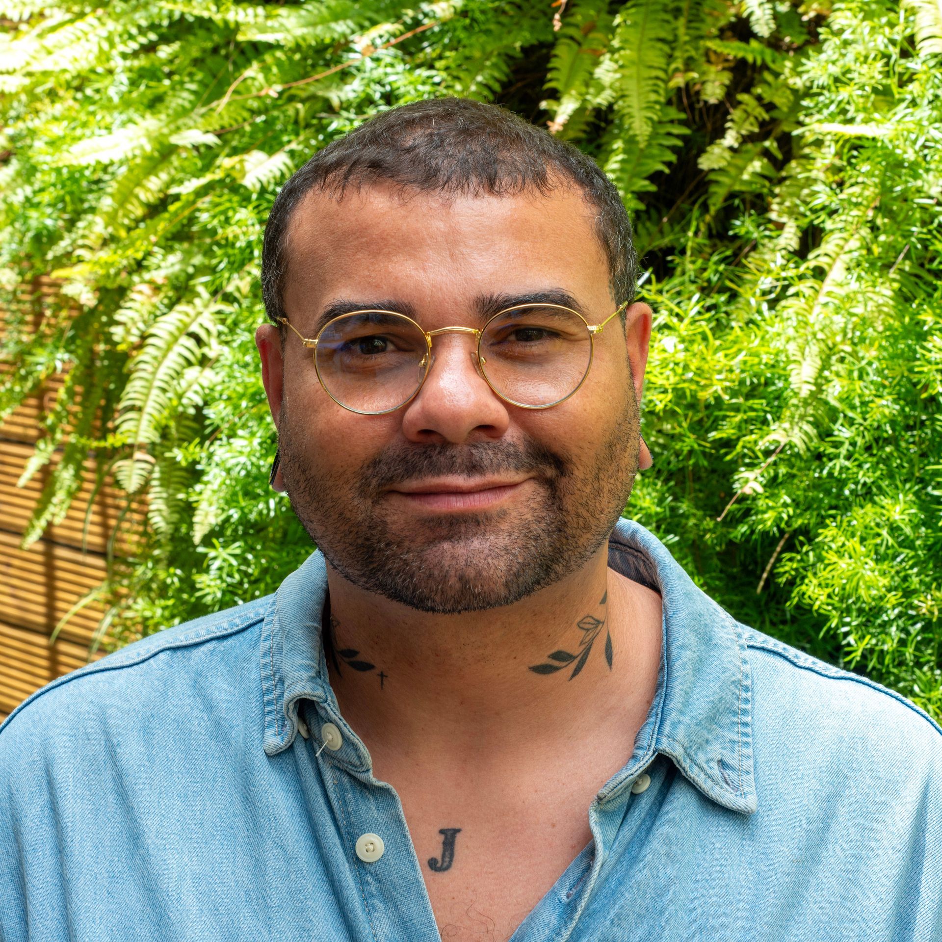 João, our warm and welcoming front desk manager, ready to assist you with a smile.