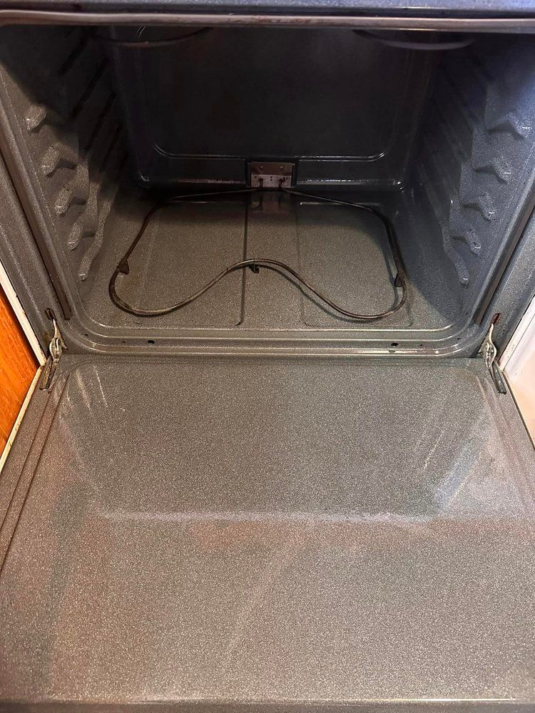 The inside of a clean oven with the door open.