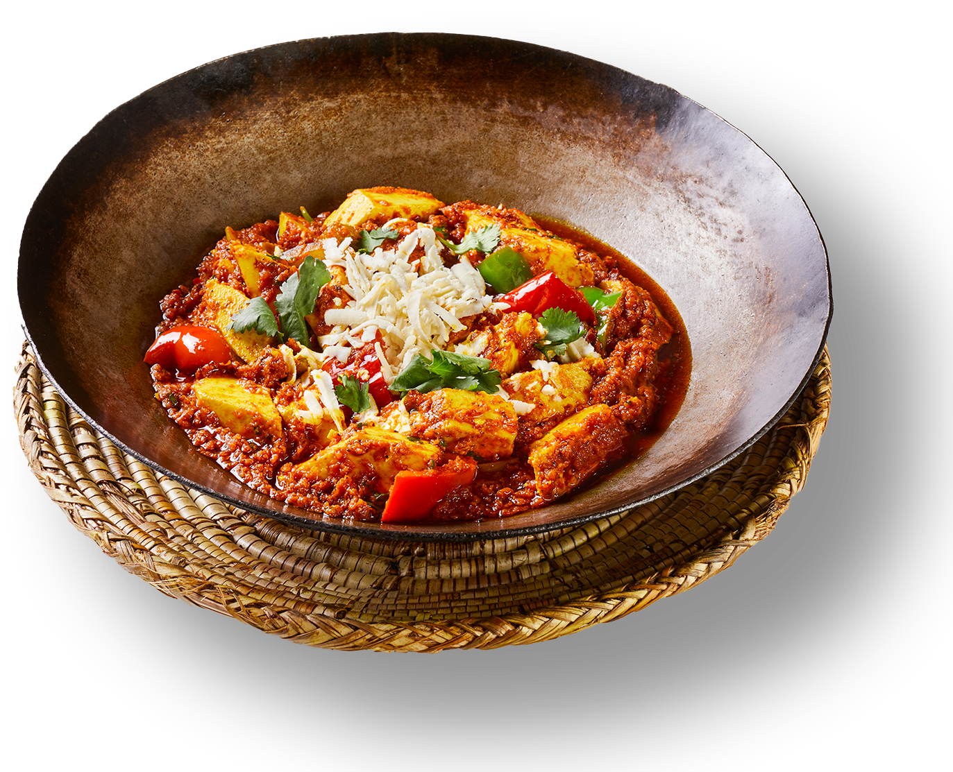 A bowl of soup with cheese and parsley on top