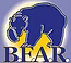 A blue bear is standing next to a yellow lightning bolt.