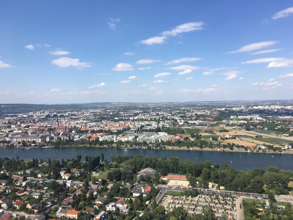An aerial view of a city with a river in the middle of it.
