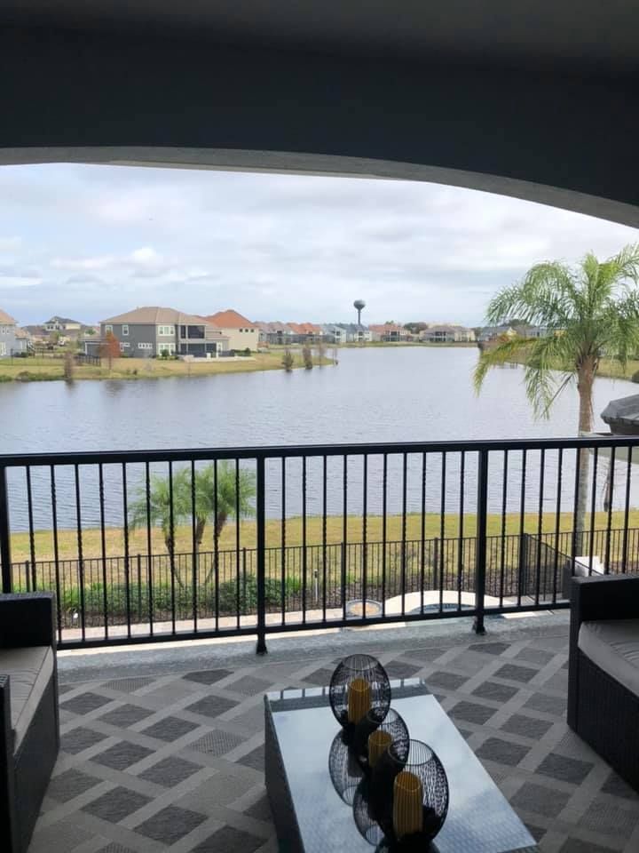 A balcony with a view of a body of water
