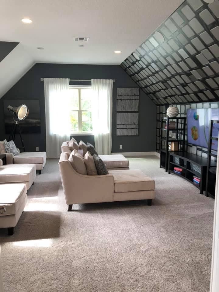 A living room with a couch and a television