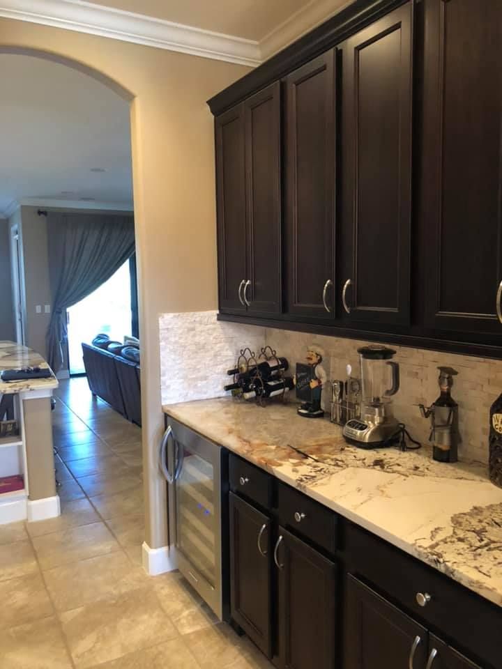 A kitchen with wooden cabinets and granite counter tops