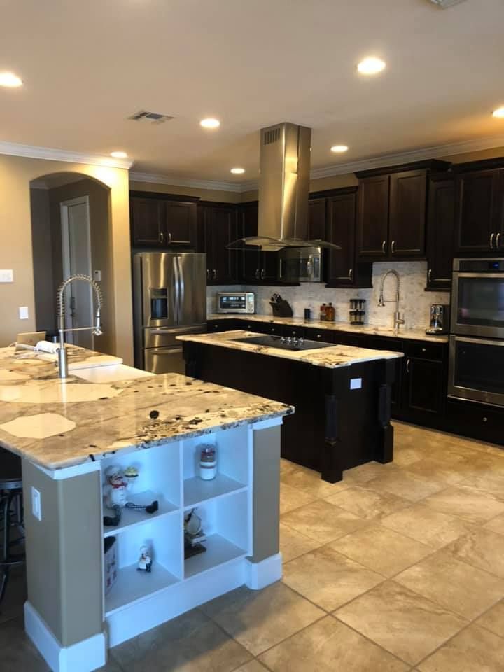 A kitchen with stainless steel appliances and granite counter tops