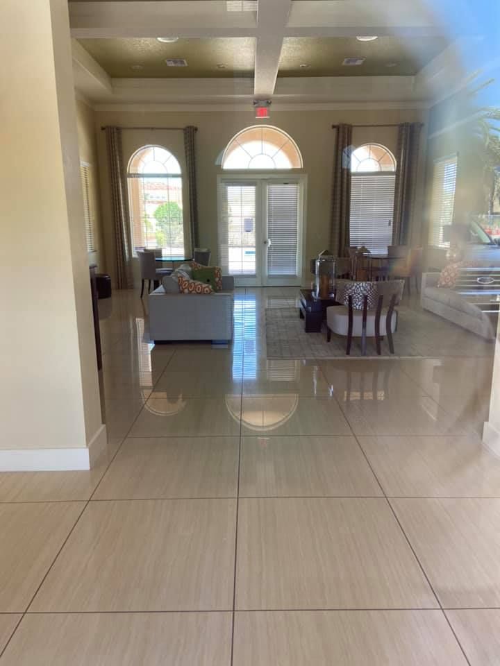 A living room with a couch , chairs , and a table.
