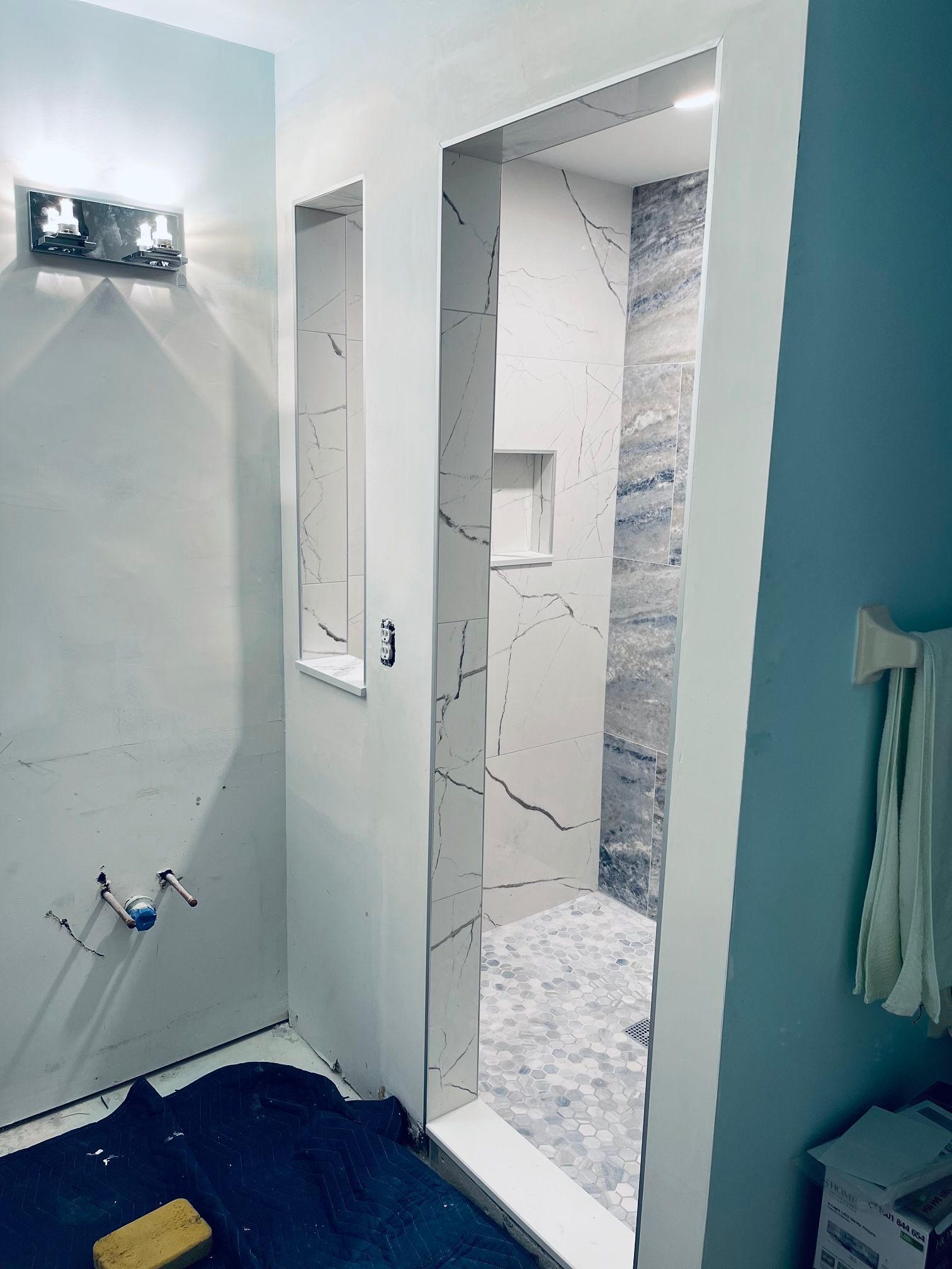 A bathroom in Palm Beach County with a doorway leading to a shower.