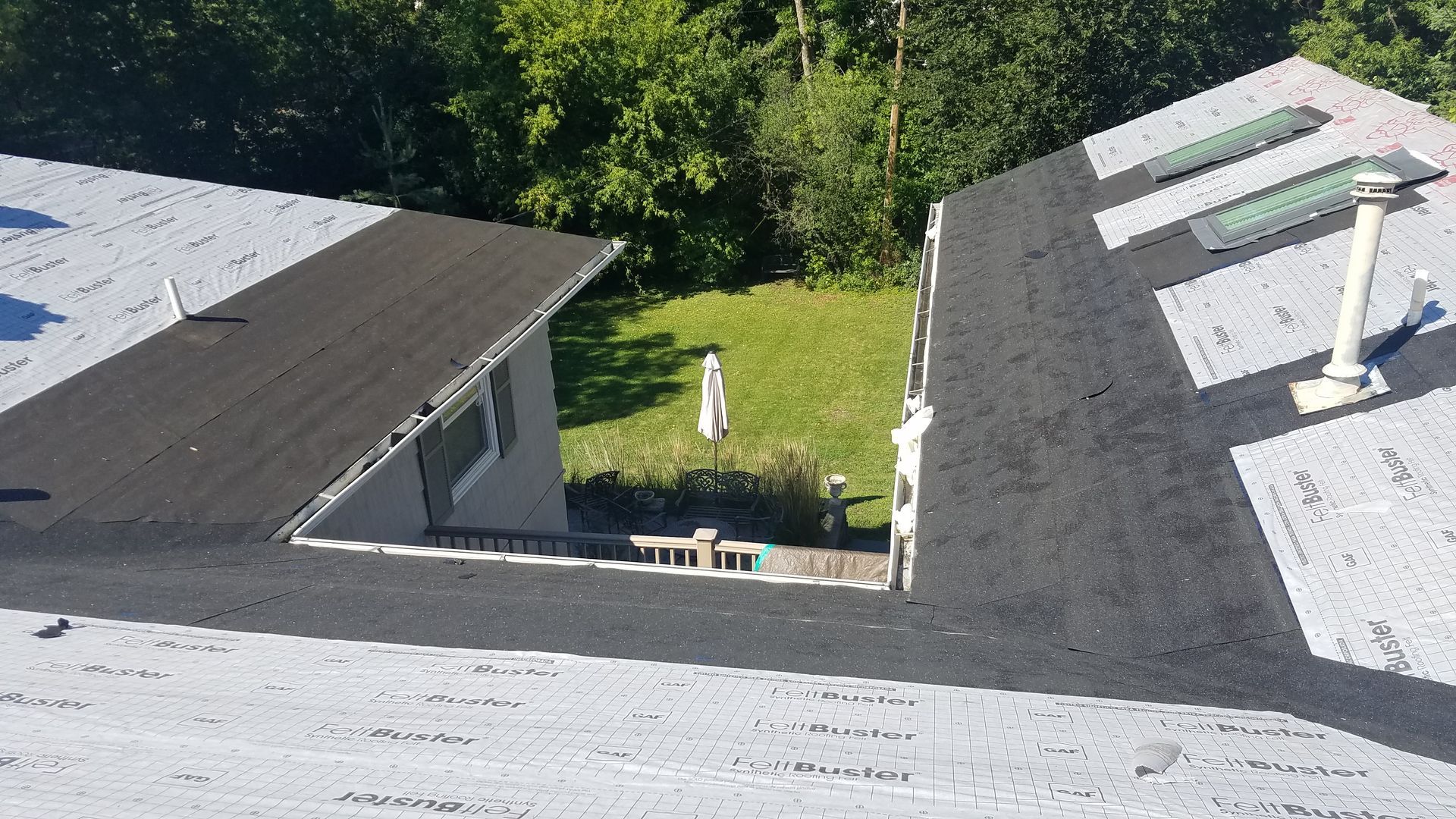 A house with a roof that has a hole in it.