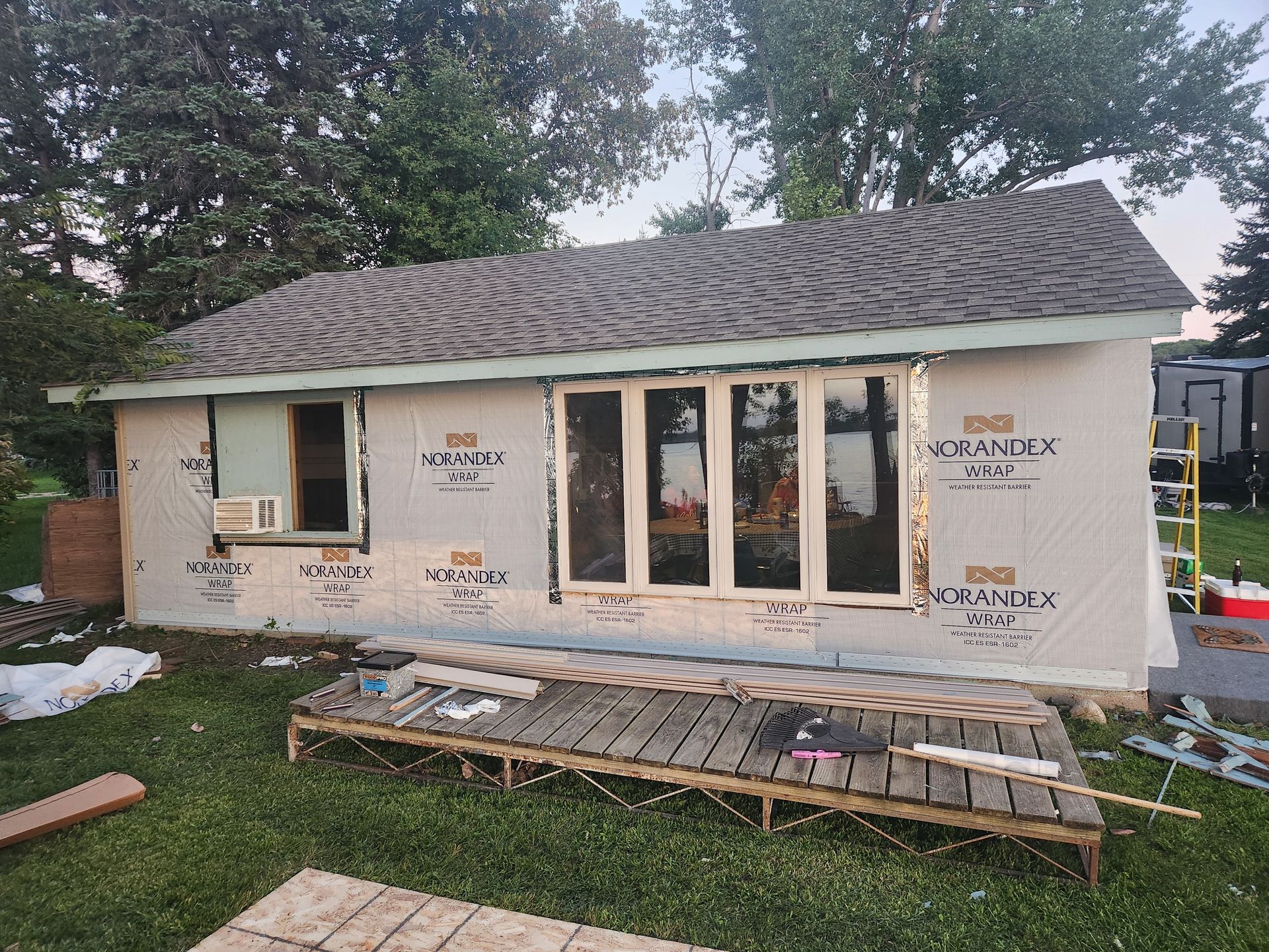 A small house is being built in a backyard.