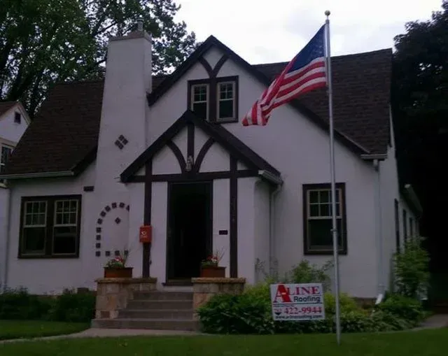 A house with an american flag flying in front of it
