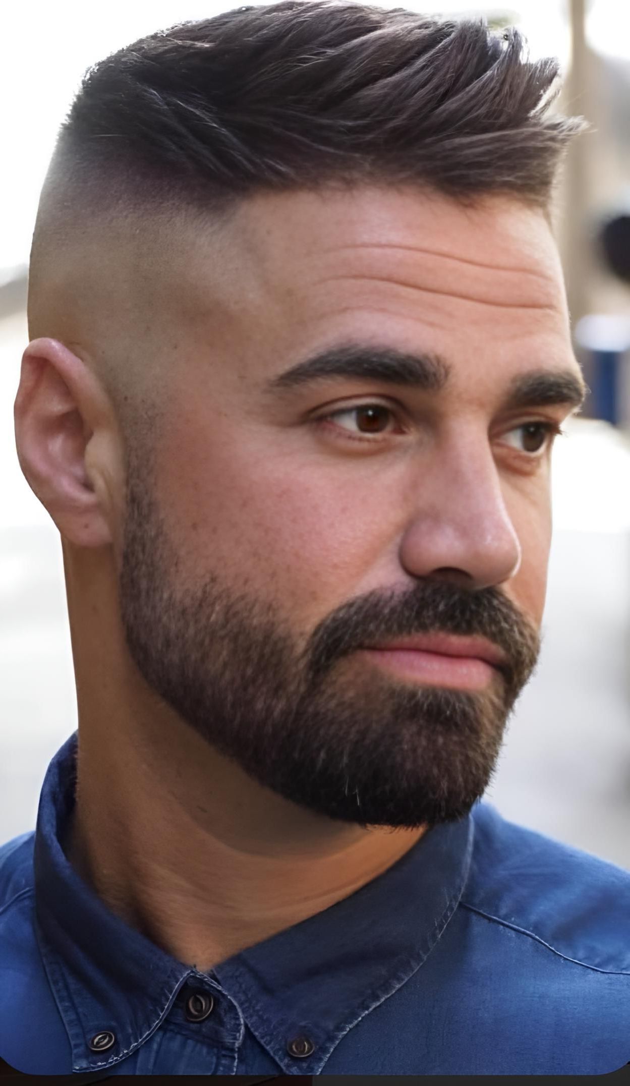 A Man With a Beard is Wearing a Blue Shirt — Dudes n Dolls Hair Lounge In Warners Bay, NSW