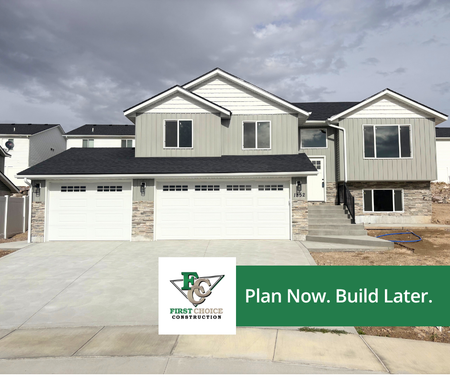 New two-story suburban house with three-car garage and “Plan Now. Build Later.” sign
