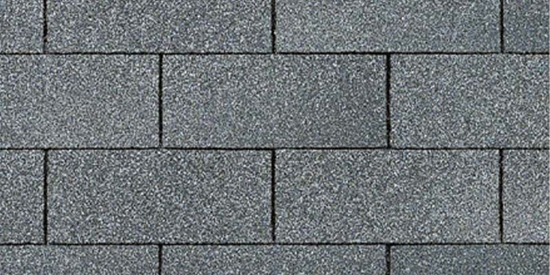 A close up of a gray brick wall.