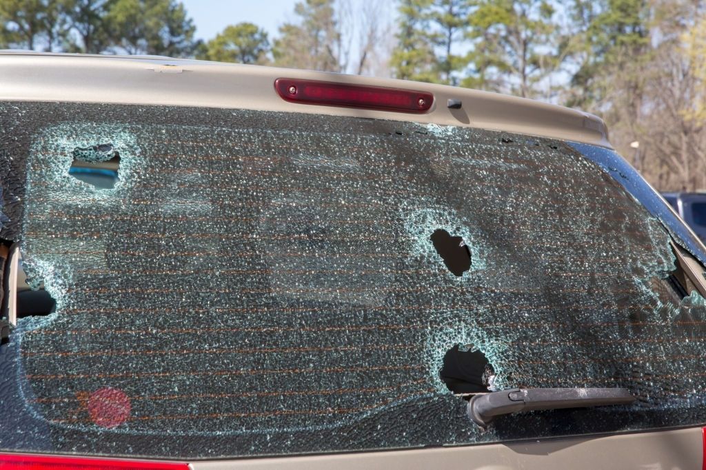 A damaged car roof due to a hail.