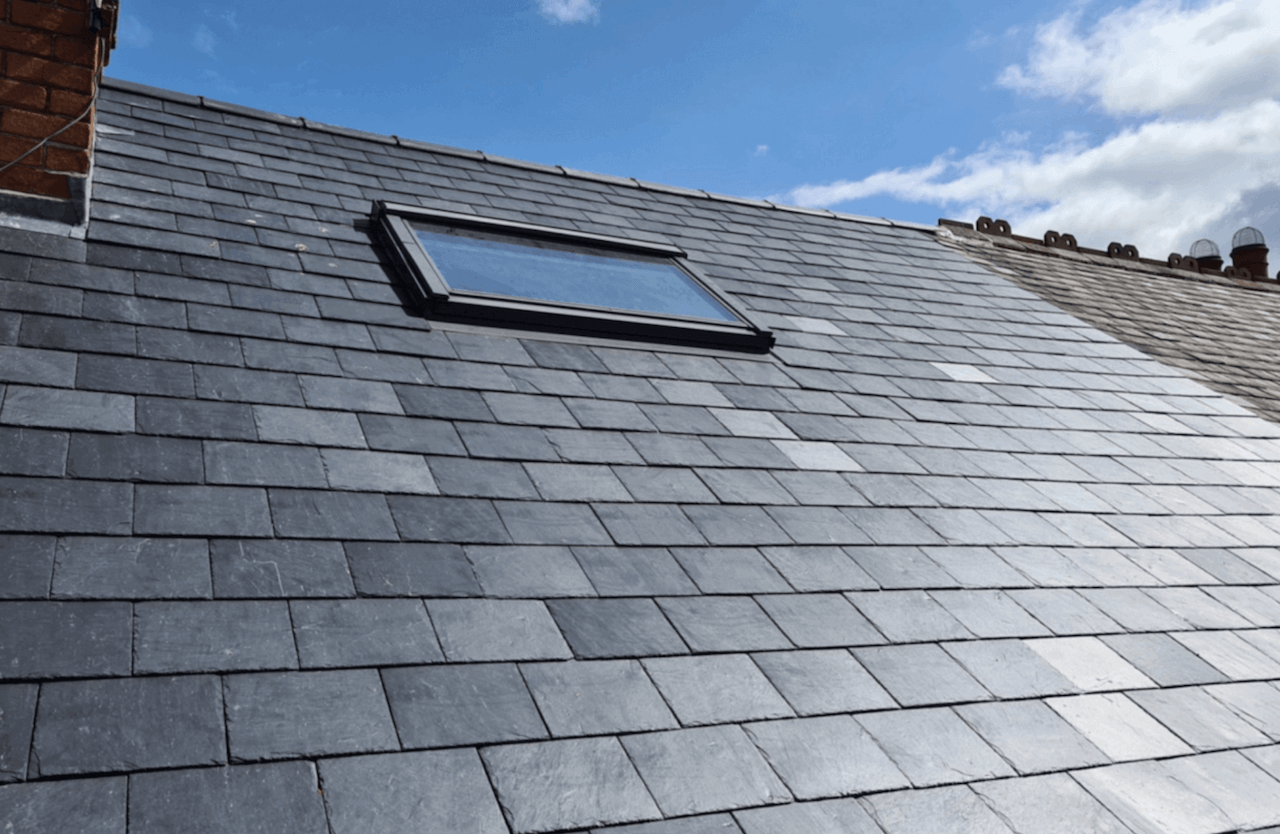 A roof with a skylight in the middle of it