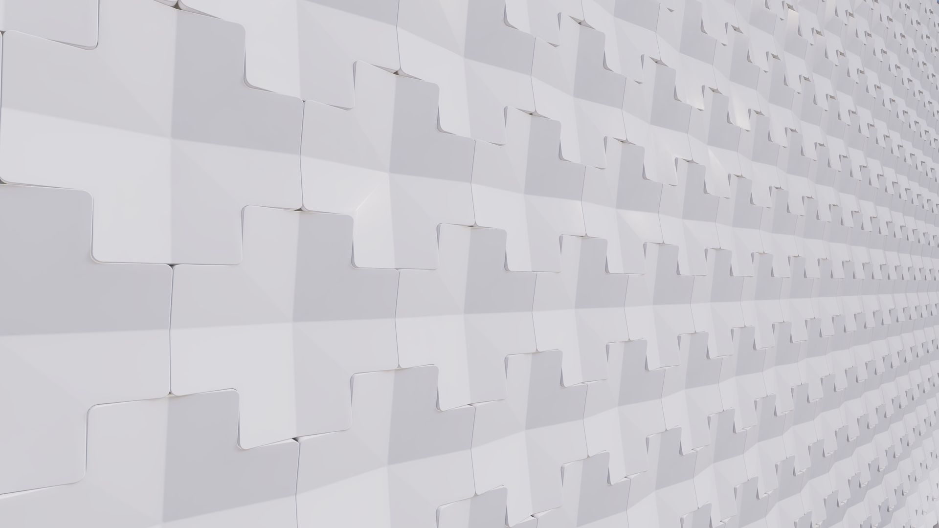 A white brick wall with a geometric pattern on it.
