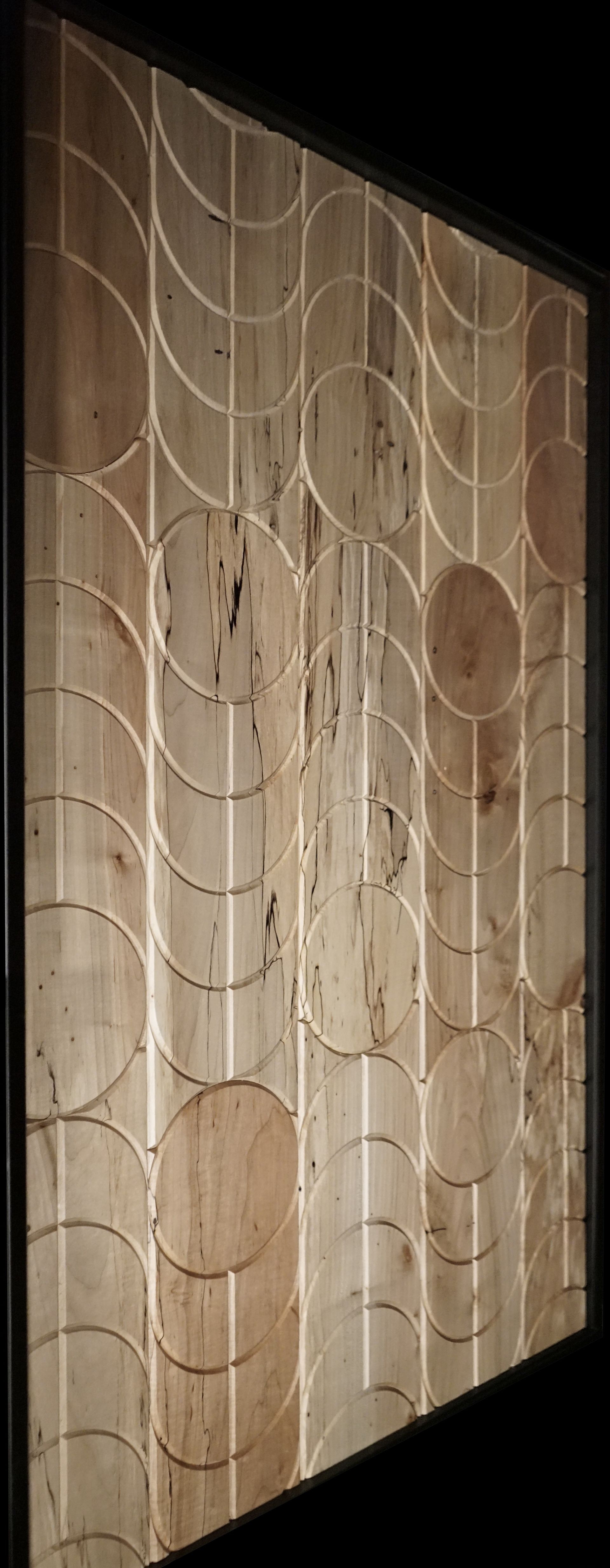 A close up of a wooden wall with a pattern on it.