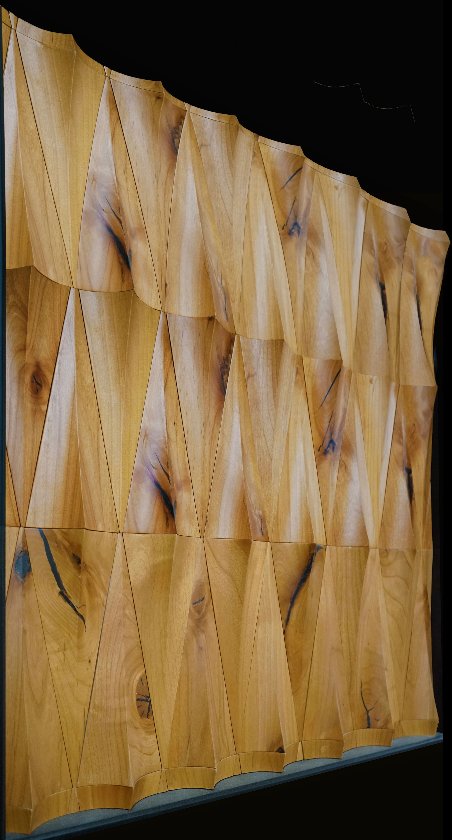 A close up of a piece of wood on a black background.