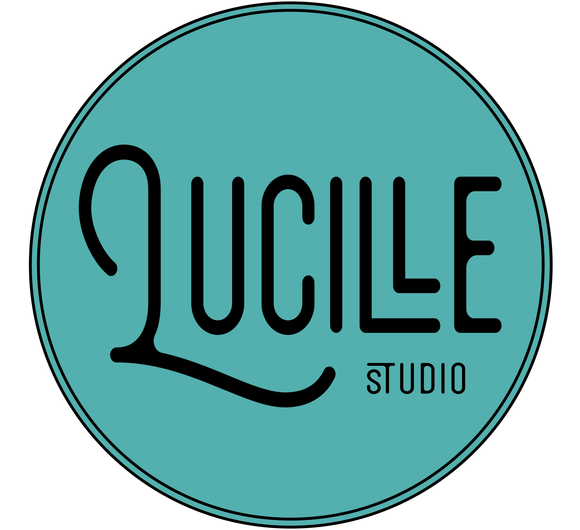 A blue circle with the word qucile studio on it