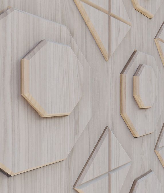 A wooden wall with geometric shapes carved into it