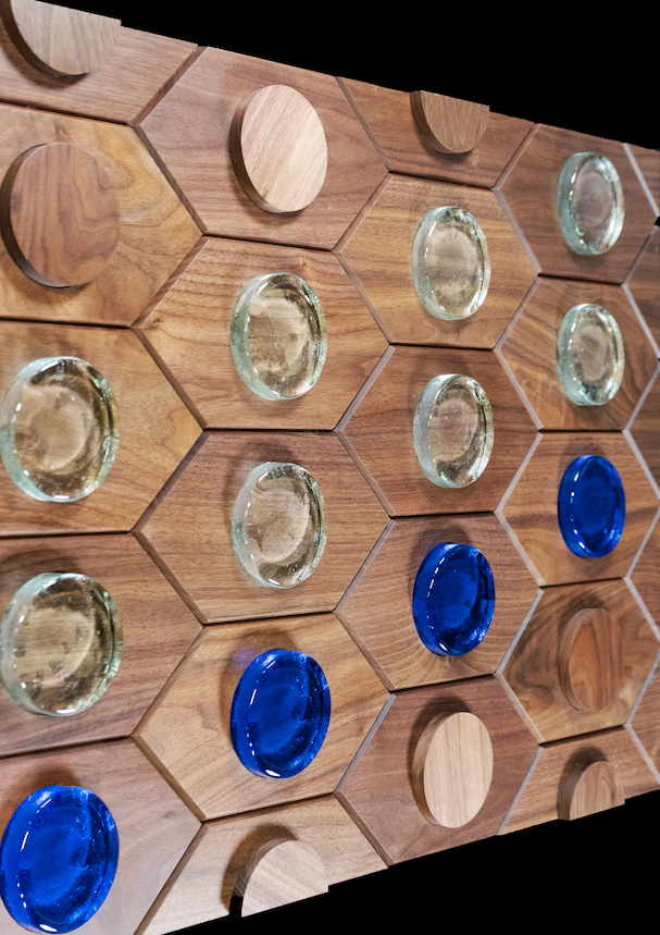 A wooden board with blue and clear circles on it