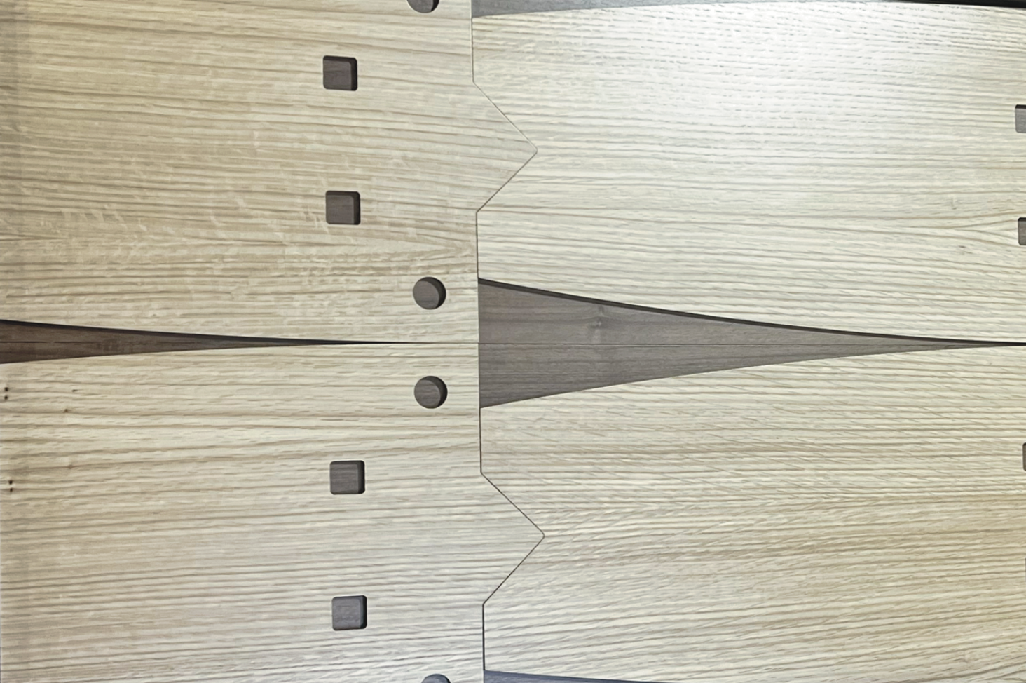 A close up of a piece of wood with holes in it.