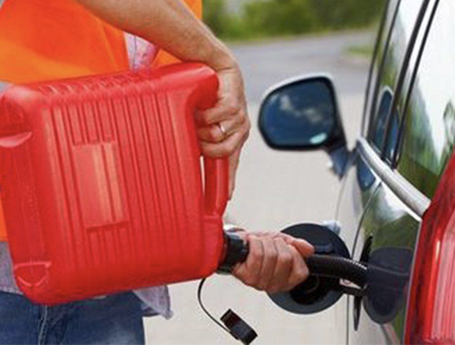 Guy putting gas in a car with gas can