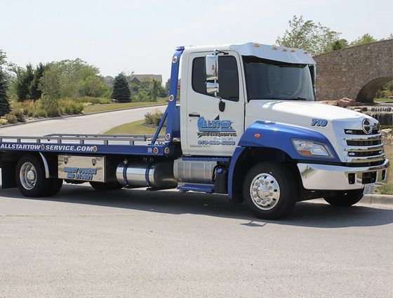 Allstar's new blue and white flatbed tow truck