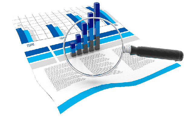 Una lupa está encima de un gráfico.